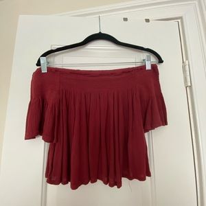 Red off-the-shoulder crop top.
